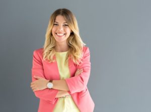 Business-dressed woman smiling