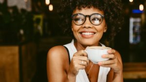 woman with ClearCorrect drinking coffee 