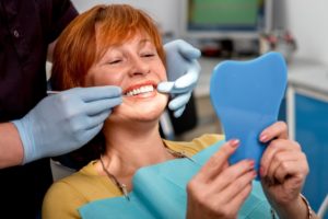 Woman smiling in the dentist's chair.