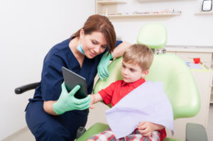 Child using a tablet at the dentist's office
